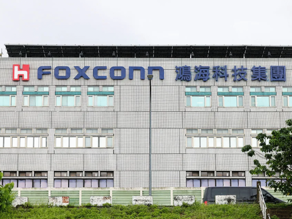 Front view of a Foxconn building in Taiwan featuring the company’s logo and signage on a tiled exterior.