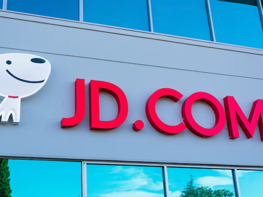 Exterior view of a JD.com office building showing the company’s logo and mascot on the facade.